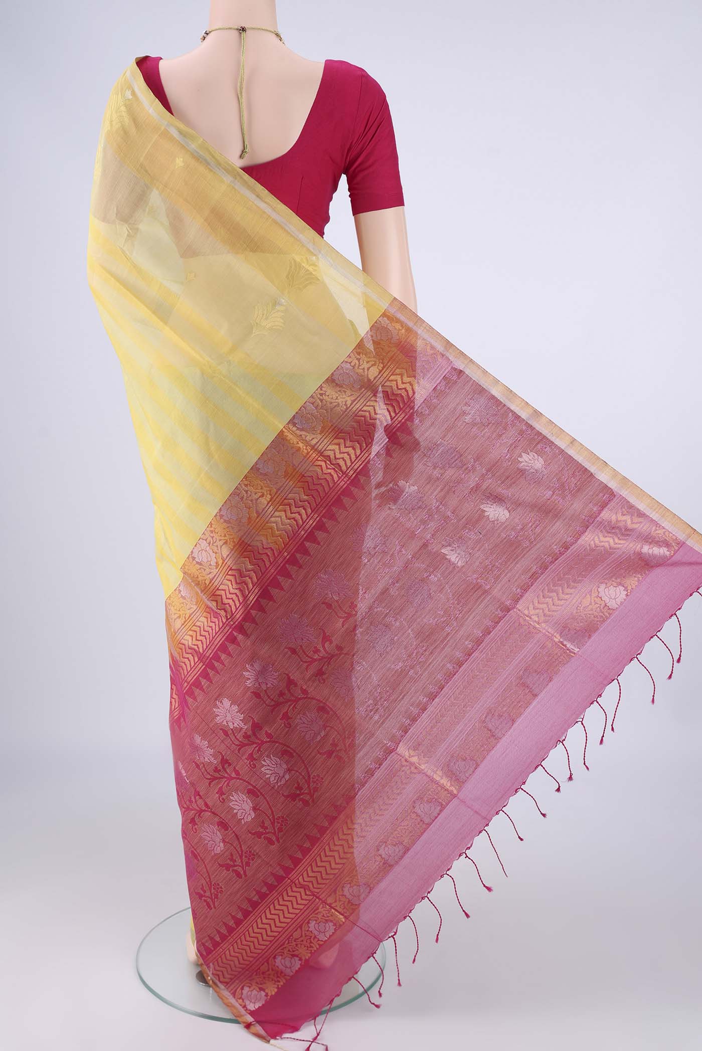 Flat view of Yellow Silk Cotton Saree with Stripes on the body and Zari Border. 