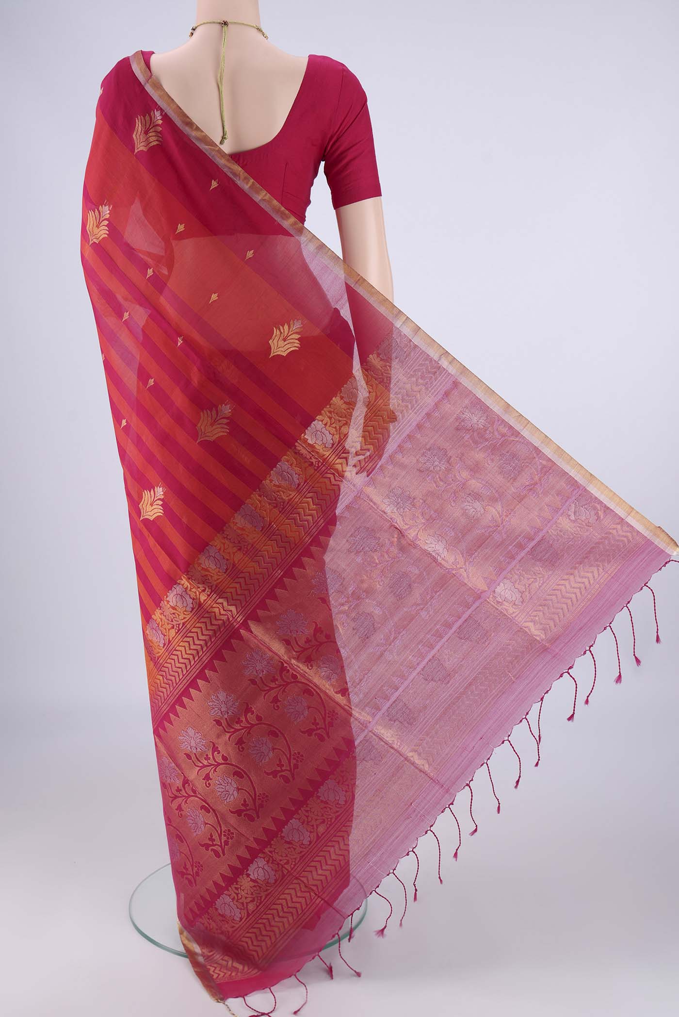 Flat view of Multi Color Silk Cotton Saree with Stripes on the body and Zari Border. 