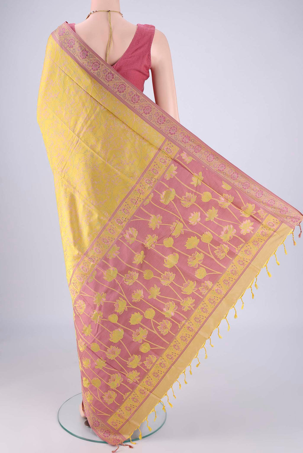 Flat view of Yellow Soft Silk Saree with Jacquard design on the body and Thread Border. 