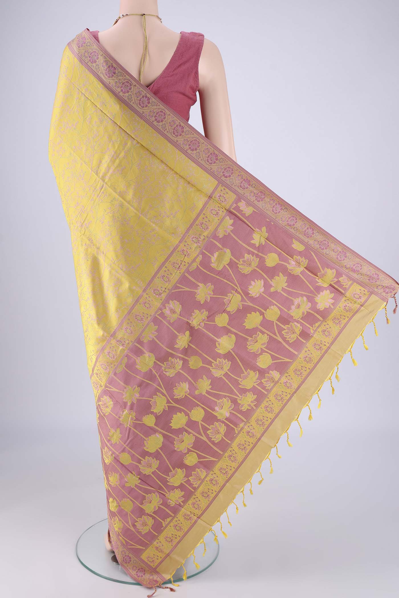 Flat view of Yellow Soft Silk Saree with Jacquard design on the body and Thread Border. 