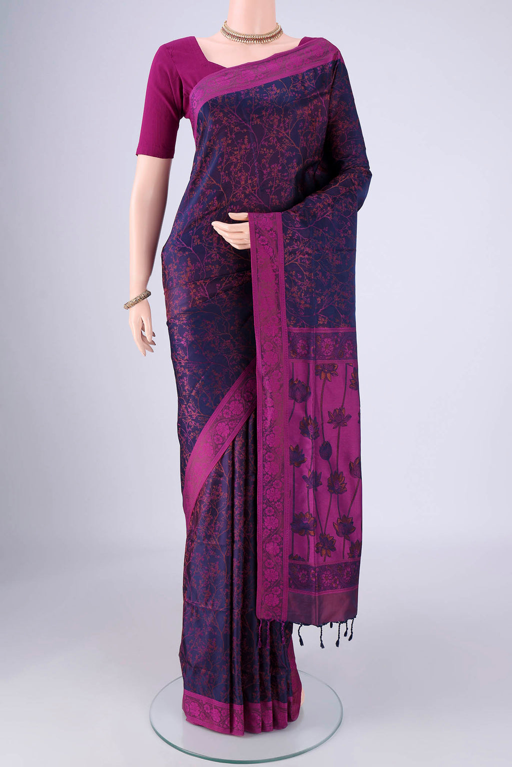 Navy Blue Soft Silk Saree with Jacquard design on the body and Thread Border.  displayed on a mannequin
