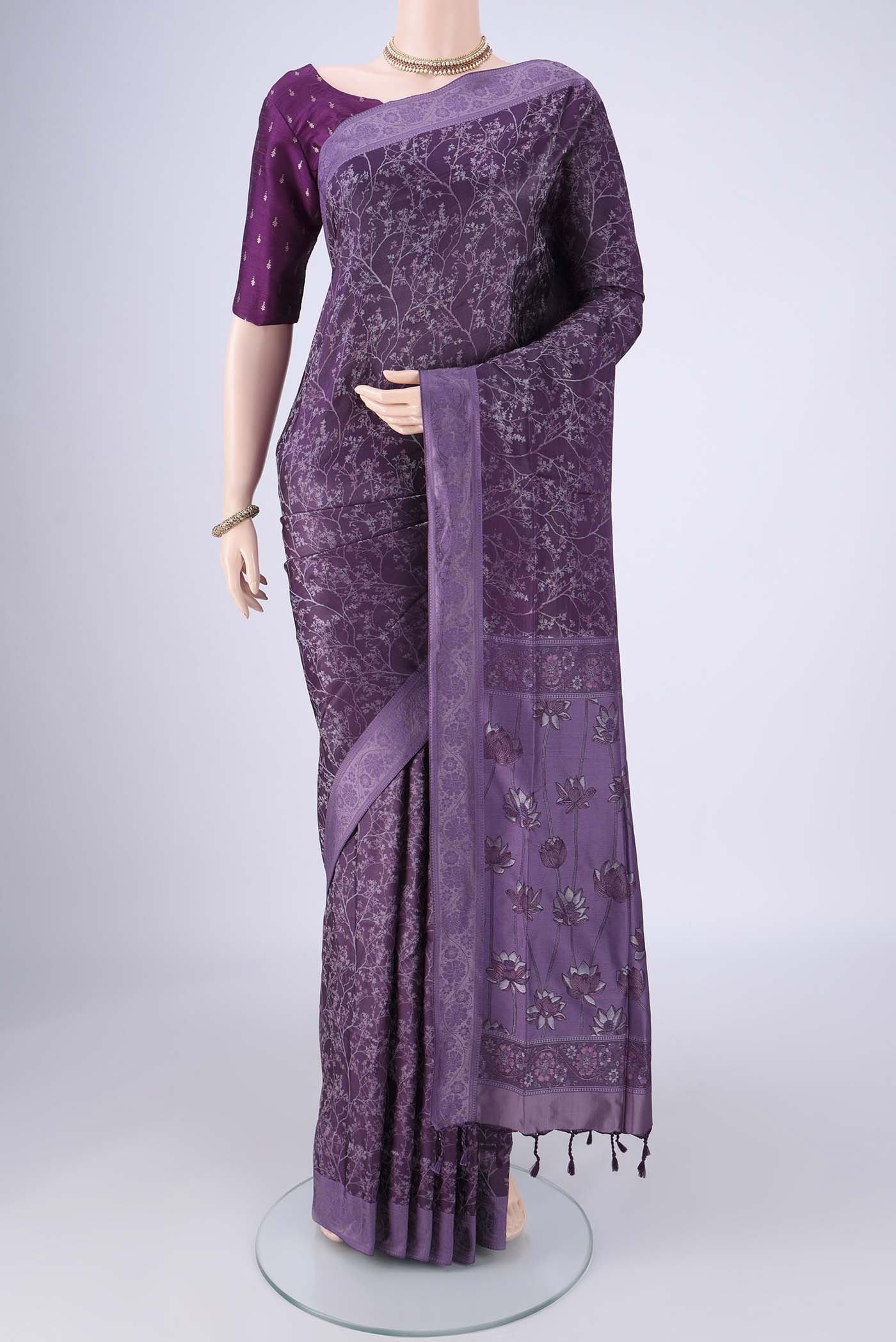 Violet Soft Silk Saree with Jacquard design on the body and Thread Border.  displayed on a mannequin