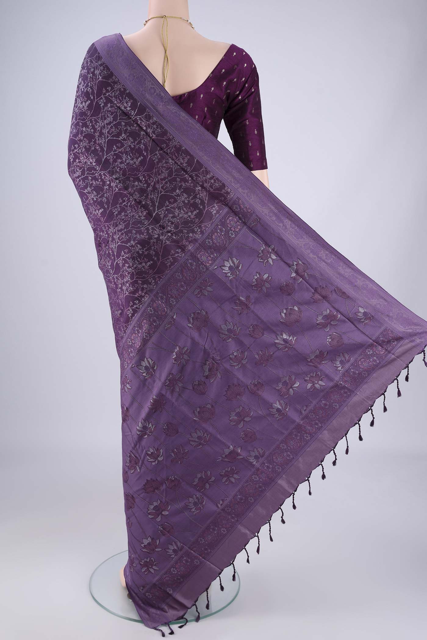 Flat view of Violet Soft Silk Saree with Jacquard design on the body and Thread Border. 
