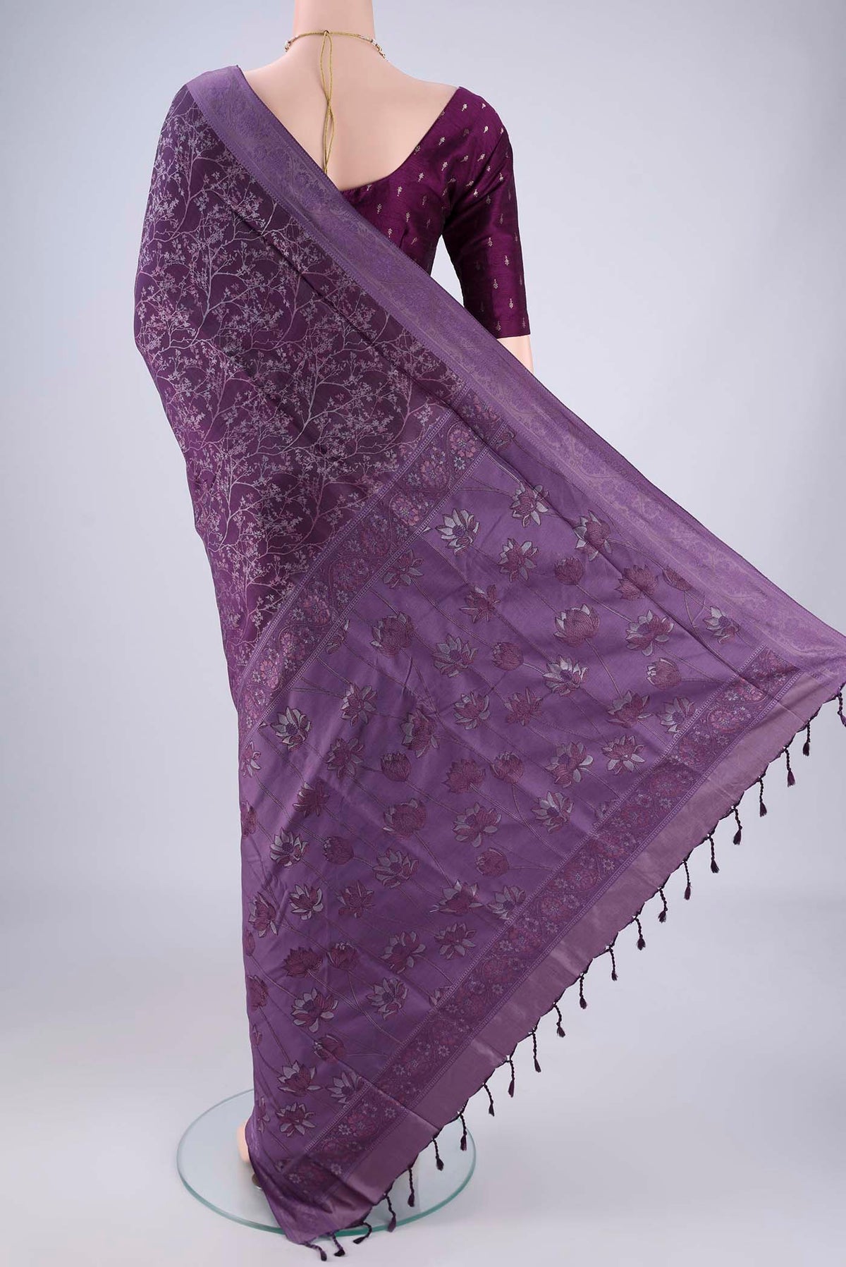 Flat view of Violet Soft Silk Saree with Jacquard design on the body and Thread Border. 