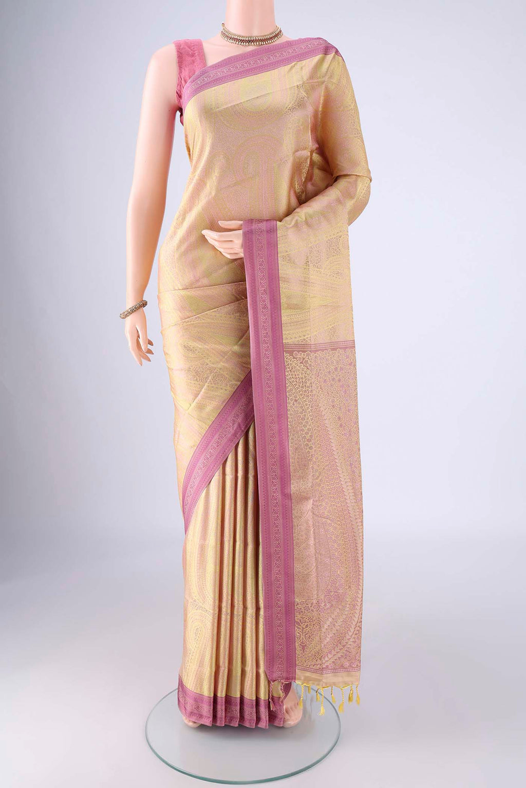 Sandal Soft Silk Saree with Jacquard design on the body and Thread Border.  displayed on a mannequin