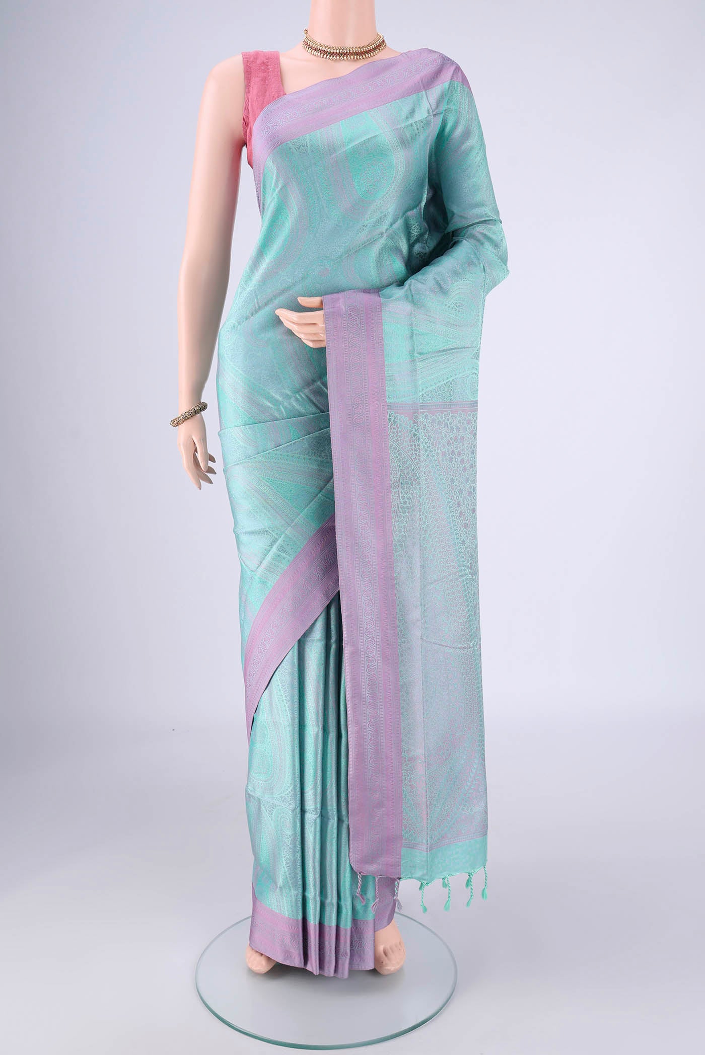 Mint Green Soft Silk Saree with Jacquard design on the body and Thread Border.  displayed on a mannequin
