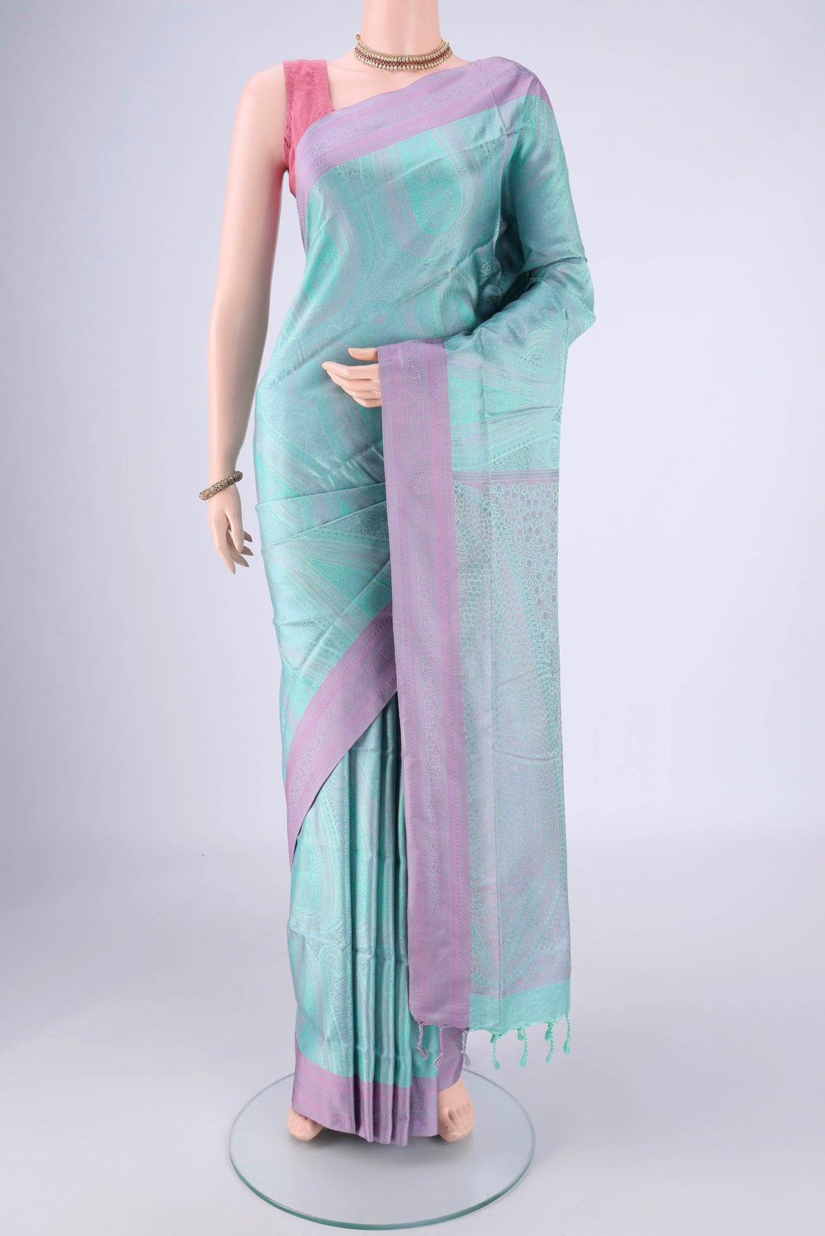 Mint Green Soft Silk Saree with Jacquard design on the body and Thread Border.  displayed on a mannequin