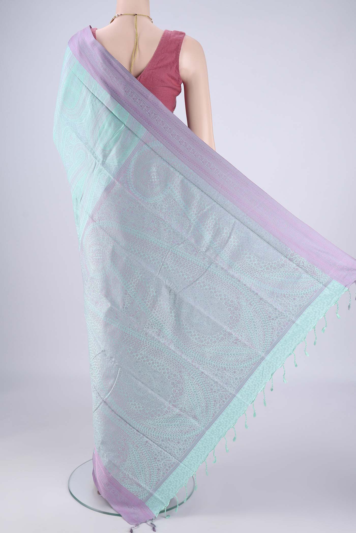 Flat view of Mint Green Soft Silk Saree with Jacquard design on the body and Thread Border. 
