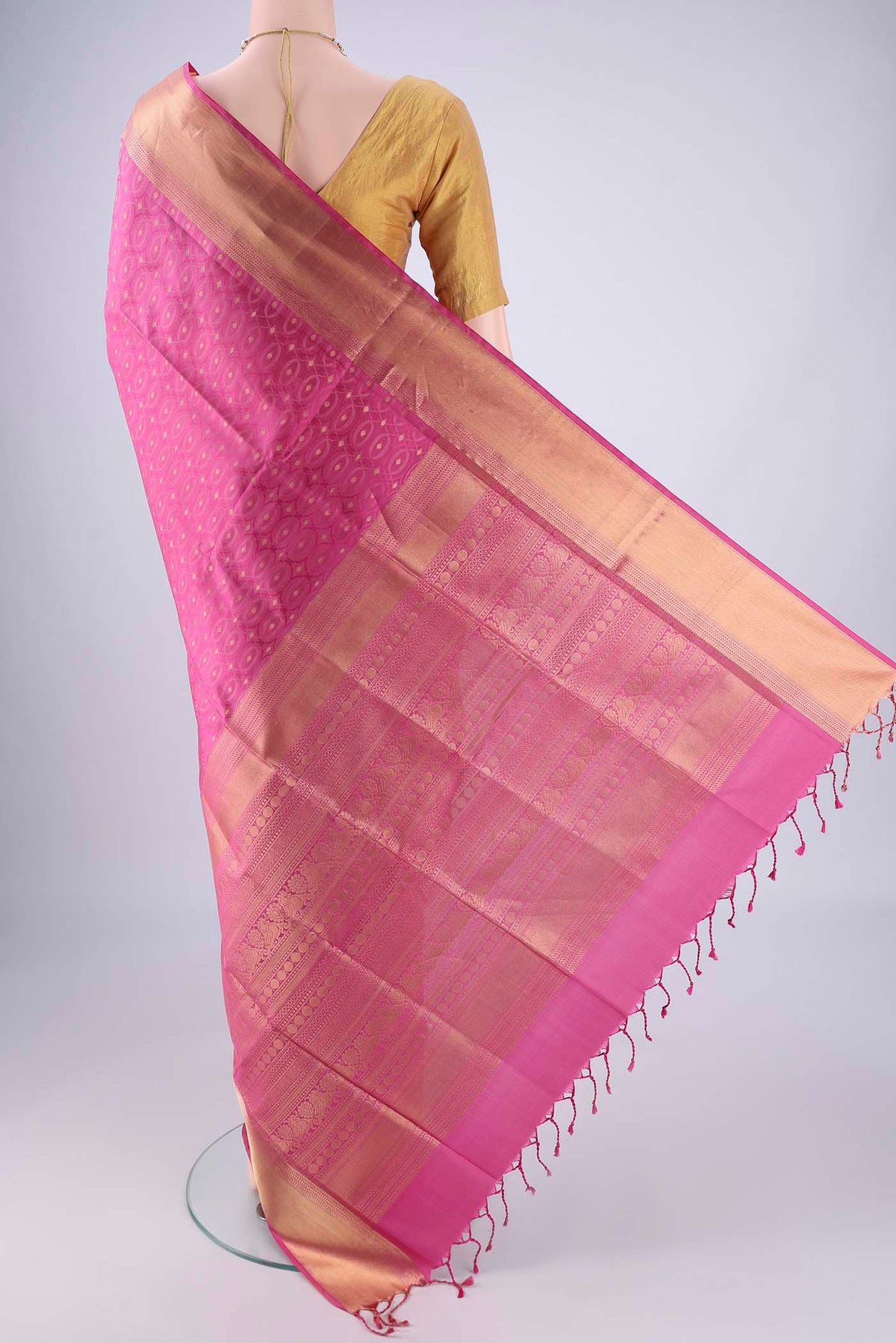 Flat view of Pink Soft Silk Saree with Jacquard With Zari Butta on the body and Zari Border. 