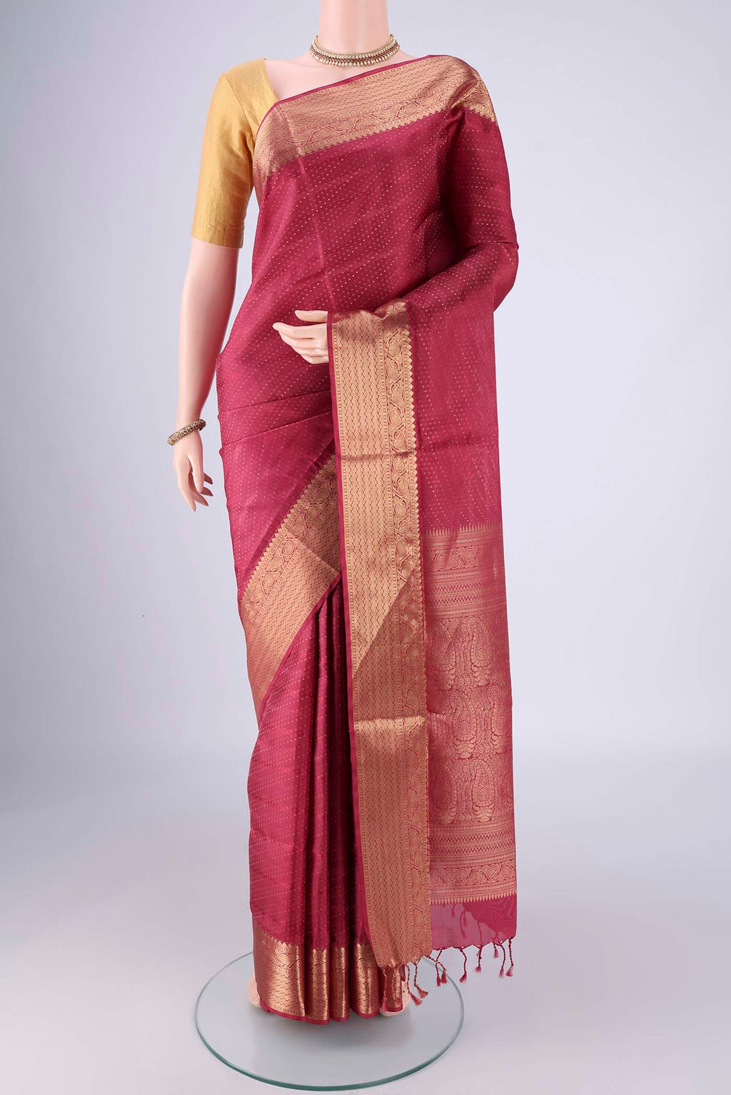 Dark Pink Soft Silk Saree with Jacquard With Zari Butta on the body and Zari Border.  displayed on a mannequin