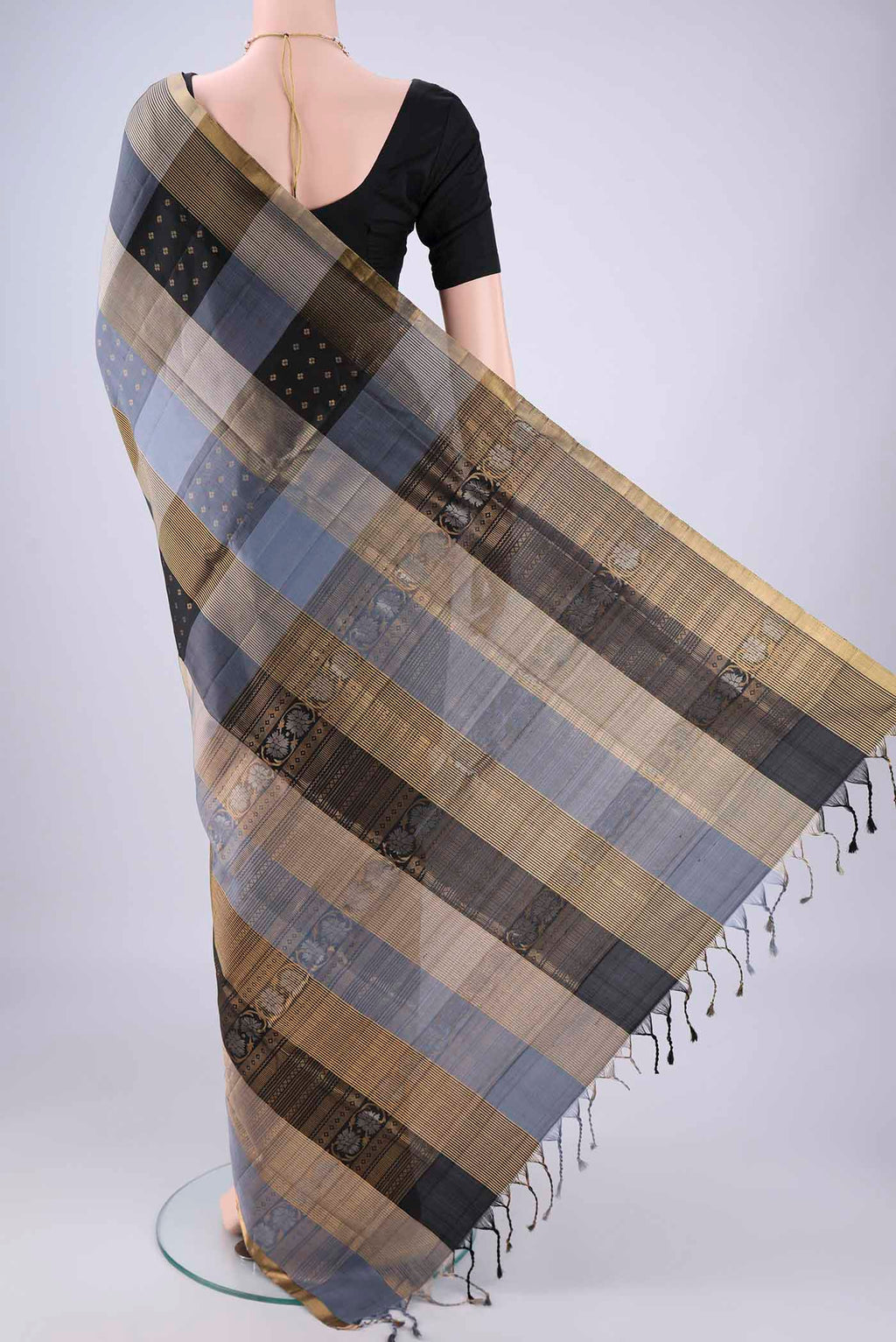Flat view of Multi Color Soft Silk Saree with Checked design on the body and Zari Border. 
