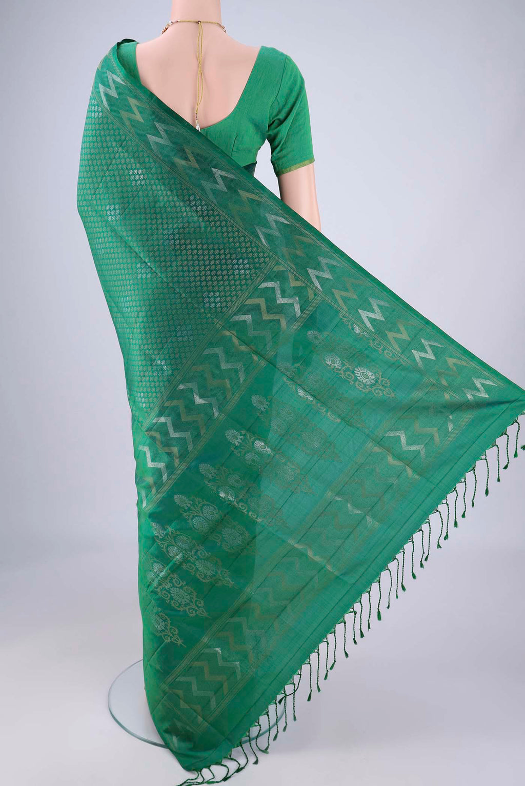 Flat view of Green Soft Silk Saree with Zari Brocade on the body and Zari Border. 