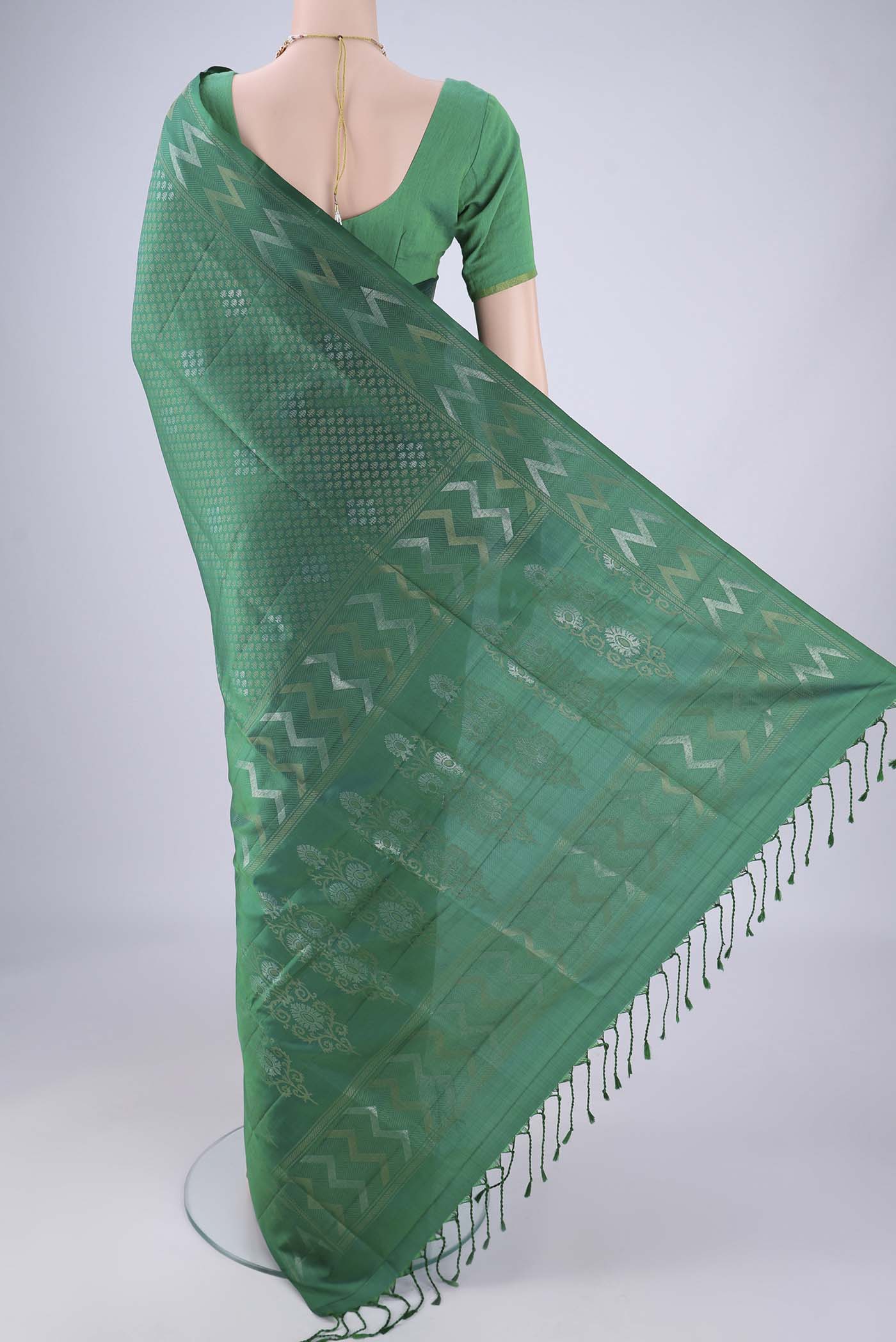 Flat view of Green Soft Silk Saree with Zari Brocade on the body and Zari Border. 