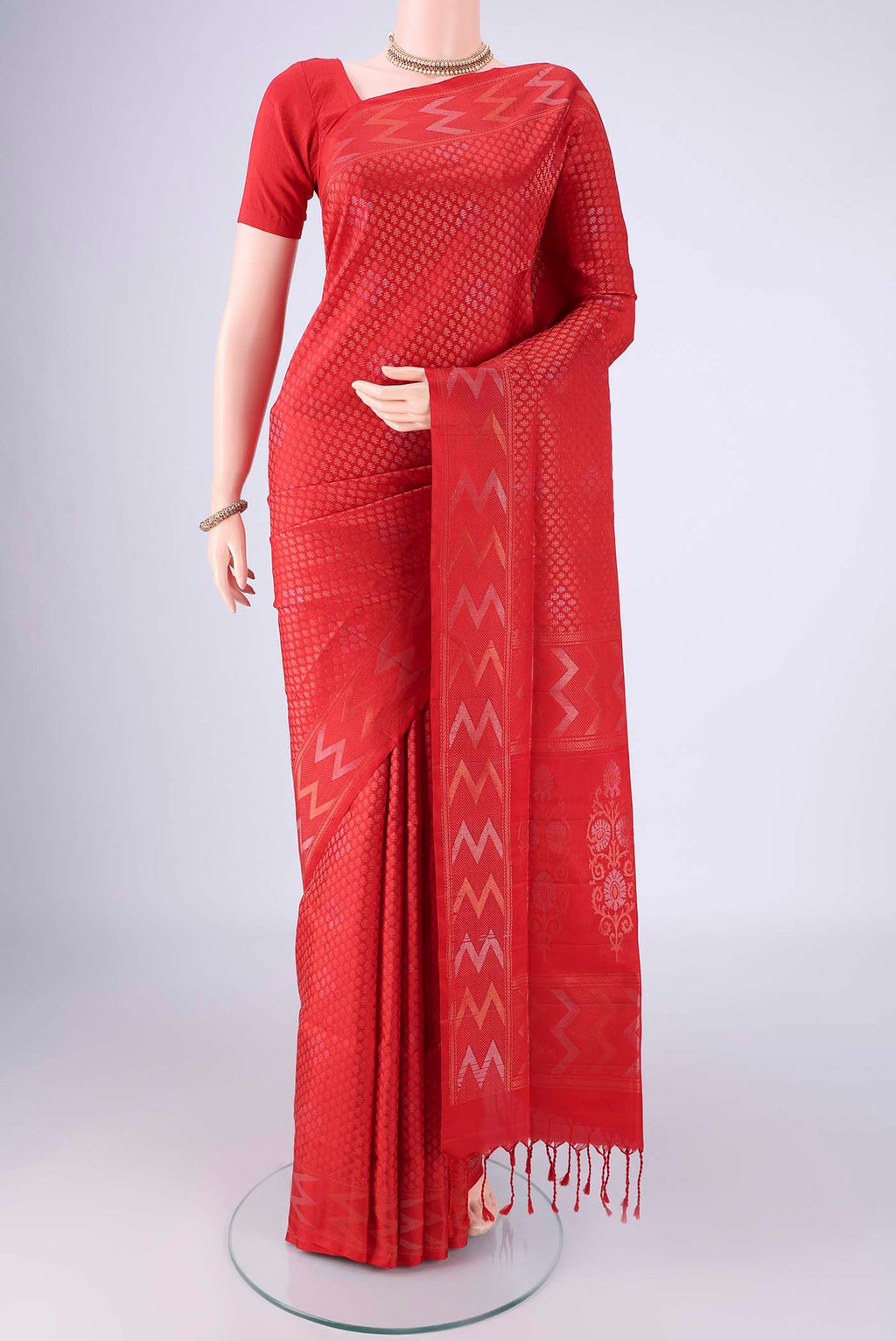 Red Soft Silk Saree with Zari Brocade on the body and Zari Border.  displayed on a mannequin