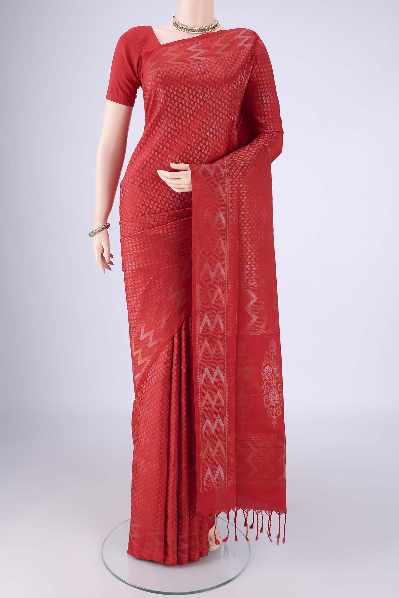 Red Soft Silk Saree with Zari Brocade on the body and Zari Border.  displayed on a mannequin