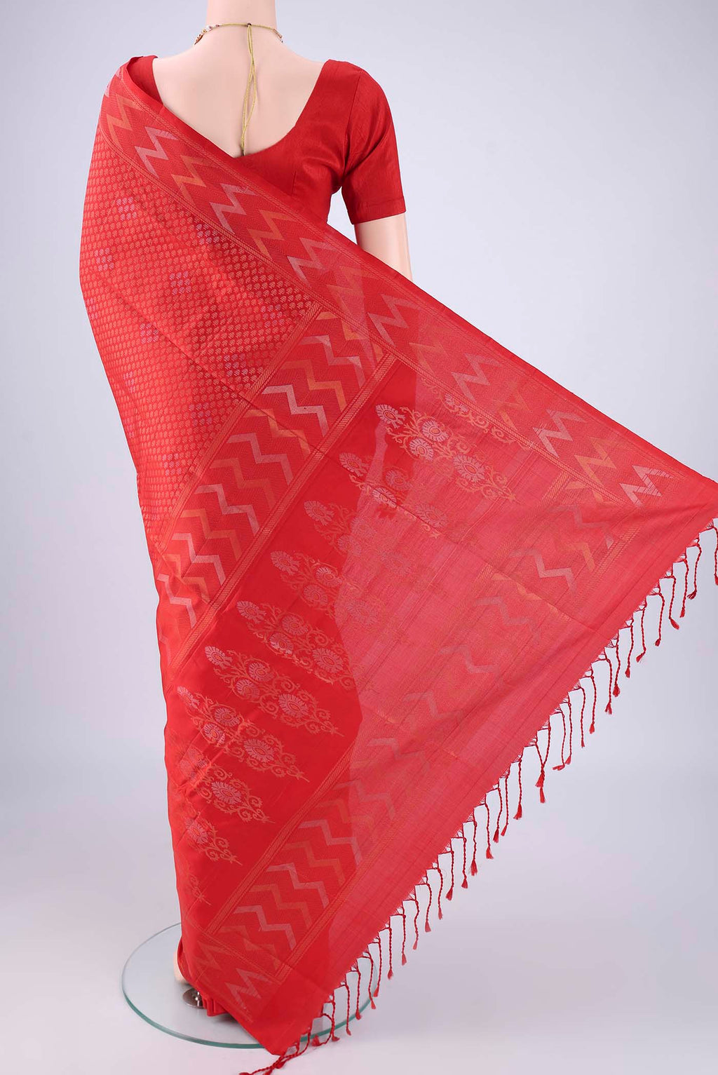 Flat view of Red Soft Silk Saree with Zari Brocade on the body and Zari Border. 