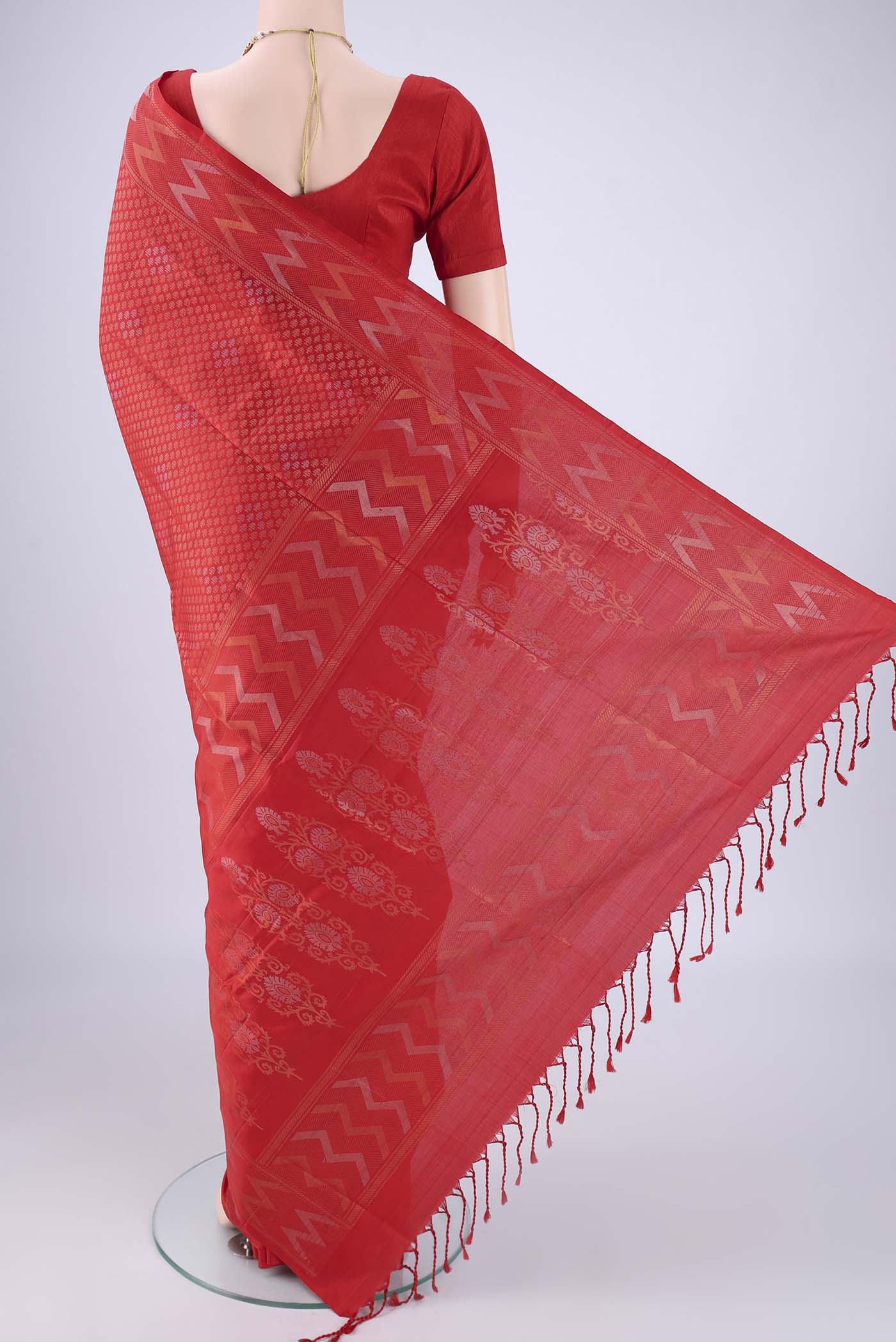 Flat view of Red Soft Silk Saree with Zari Brocade on the body and Zari Border. 