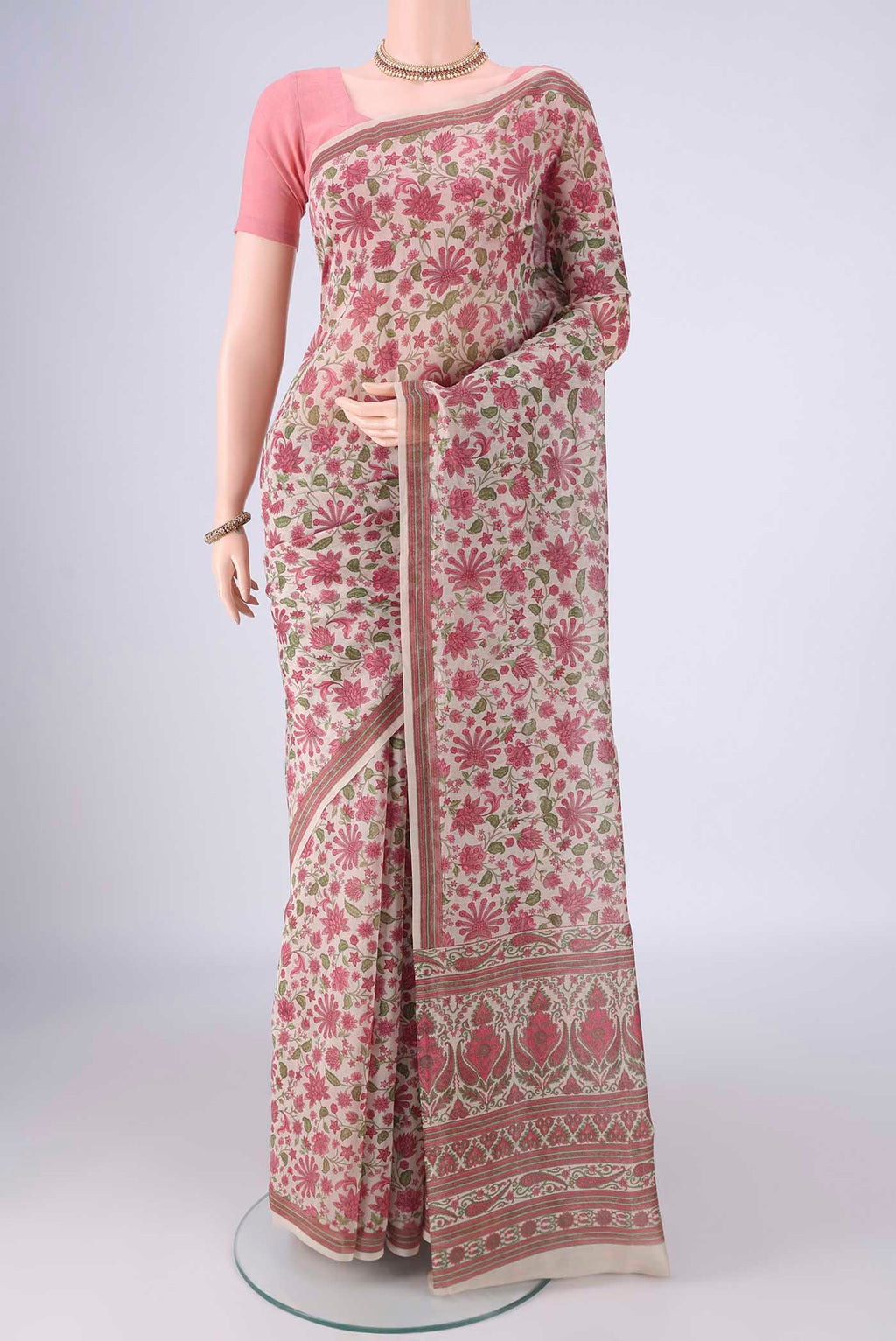Beige Chanderi Silk Cotton Saree with Floral Print on the body and Printed Border.  displayed on a mannequin