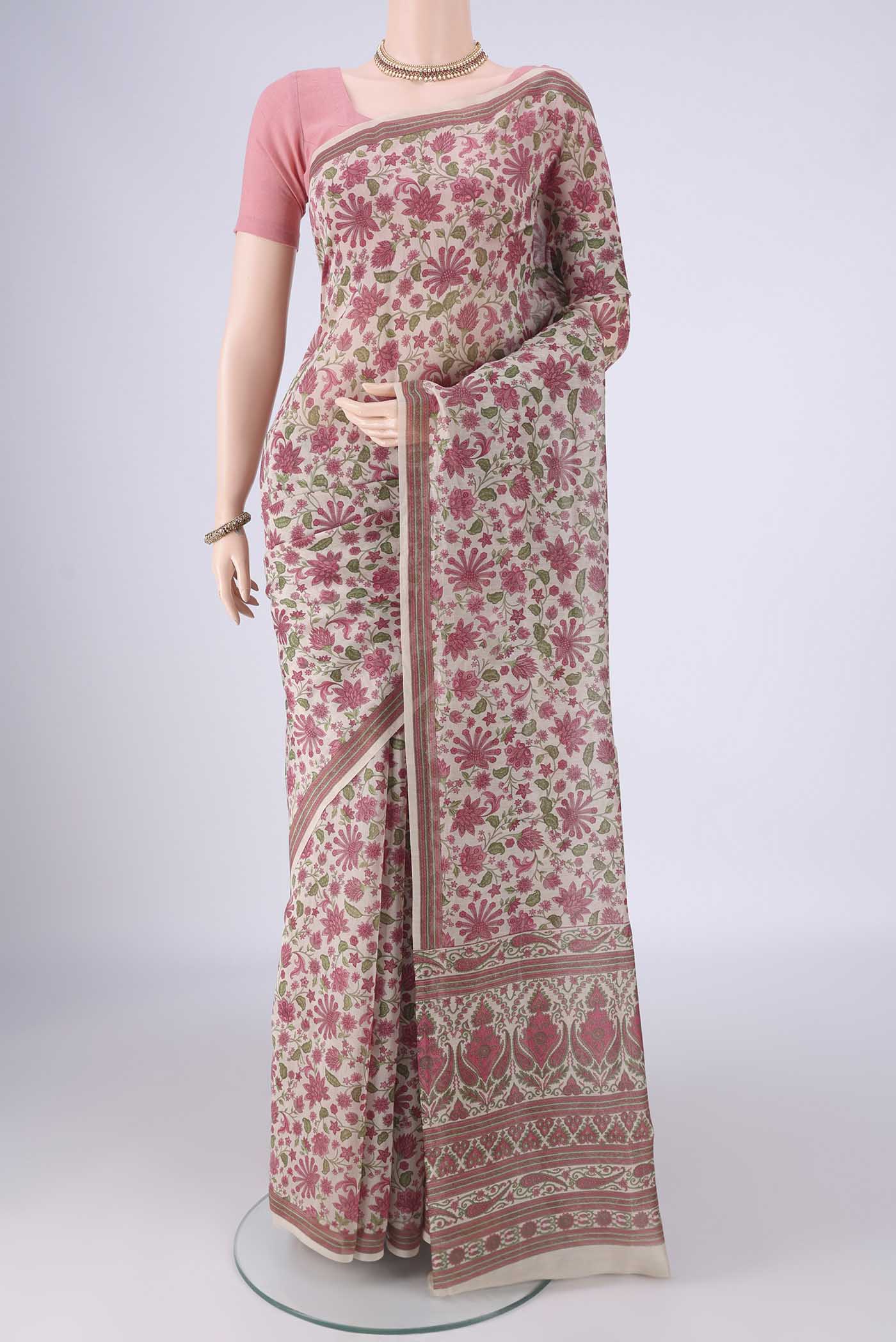 Beige Chanderi Silk Cotton Saree with Floral Print on the body and Printed Border.  displayed on a mannequin