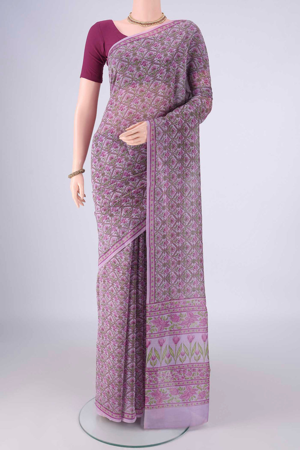 Lavender Chanderi Silk Cotton Saree with Floral Print on the body and Printed Border.  displayed on a mannequin