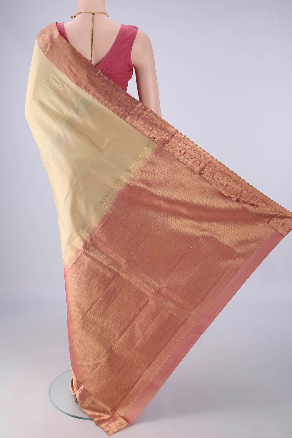 Flat view of Beige Kanjivaram Silk Saree with Zari Butta on the body and Zari Border. 