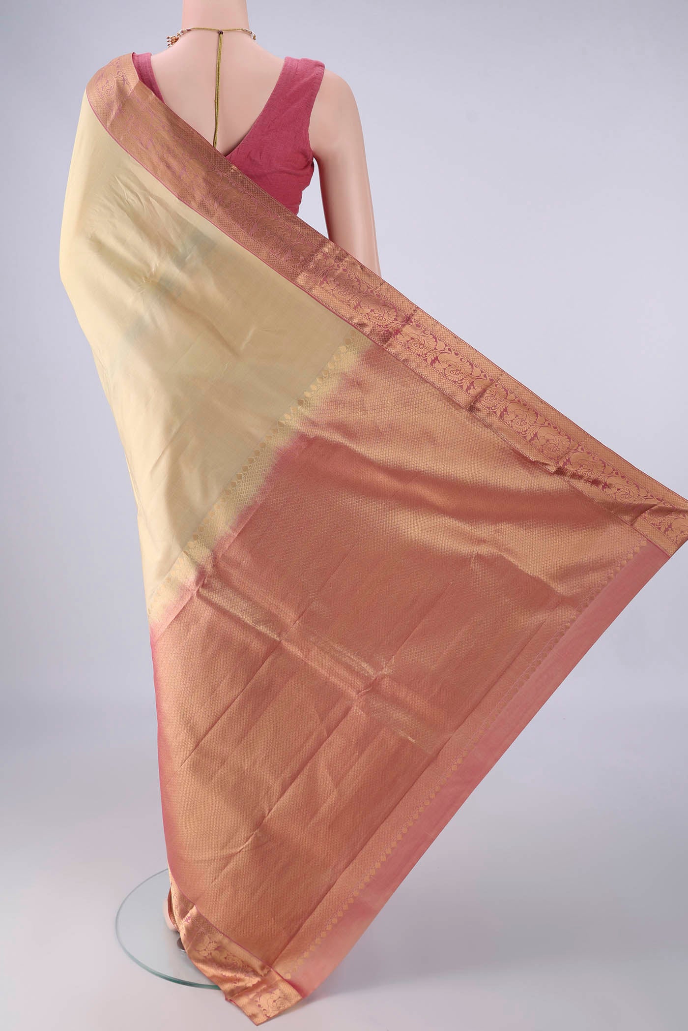 Flat view of Beige Kanjivaram Silk Saree with Zari Butta on the body and Zari Border. 