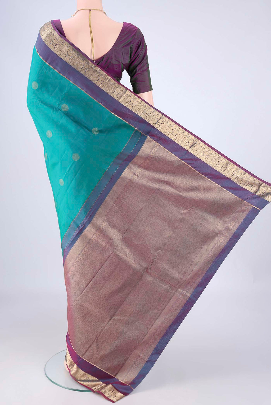 Flat view of Sea Green Kanchipuram Silk Saree with Zari Butta on the body and Zari Border. 