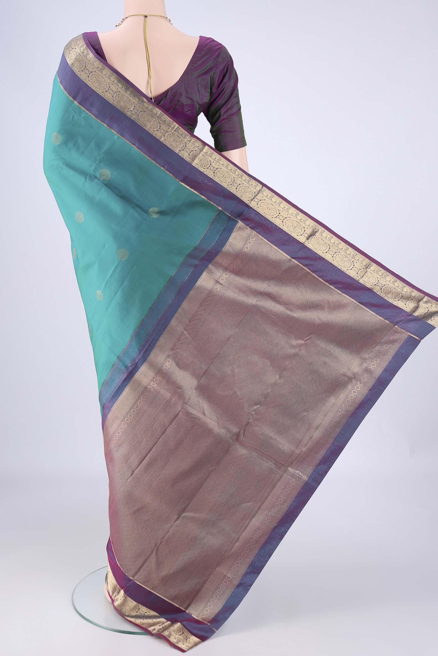 Flat view of Sea Green Kanchipuram Silk Saree with Zari Butta on the body and Zari Border. 