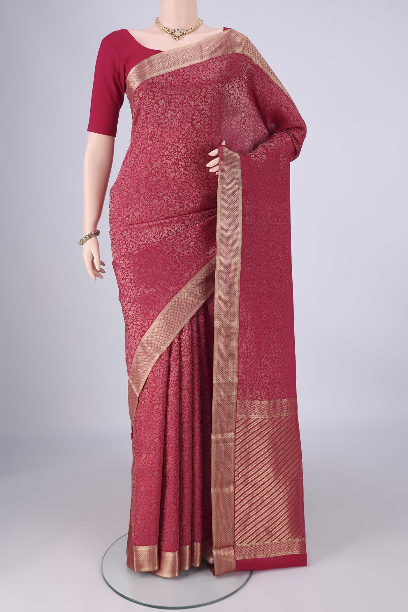 Rani Pink Mysore Crepe Saree with Zari Brocade on the body and Zari Border.  displayed on a mannequin