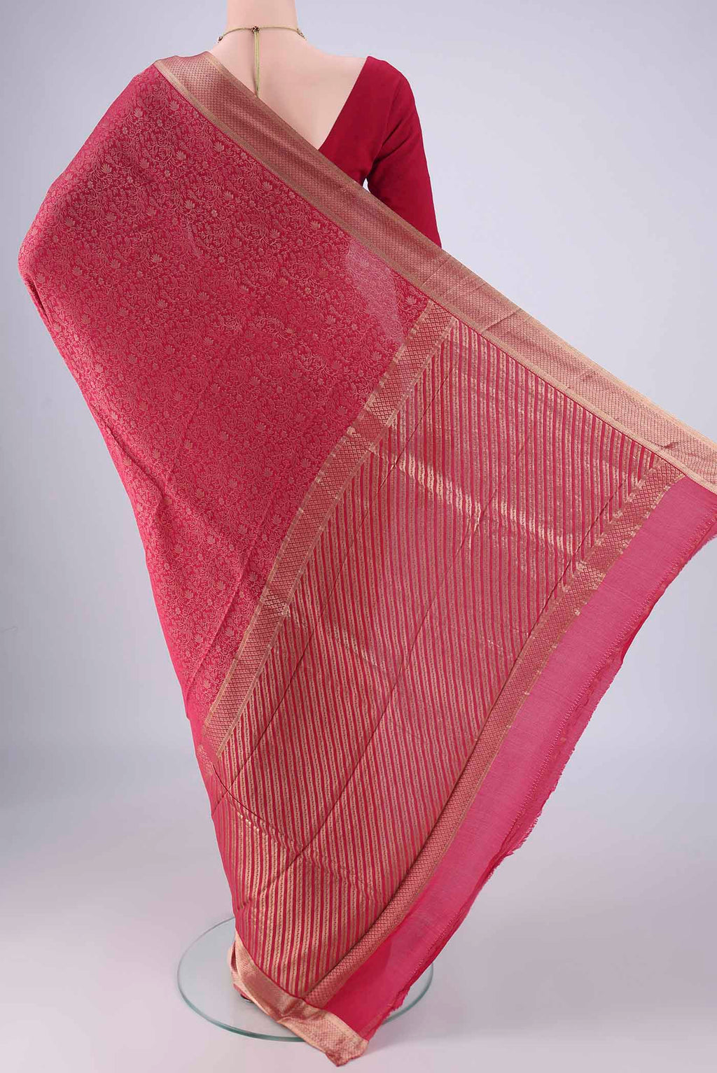 Flat view of Rani Pink Mysore Crepe Saree with Zari Brocade on the body and Zari Border. 