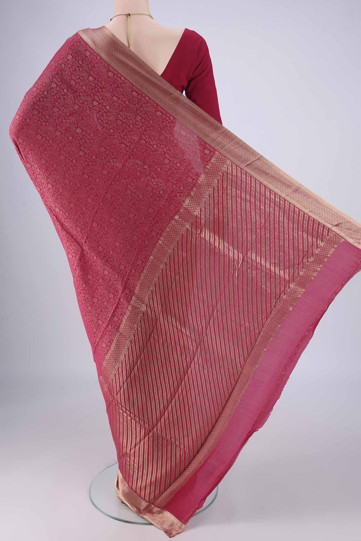 Flat view of Rani Pink Mysore Crepe Saree with Zari Brocade on the body and Zari Border. 