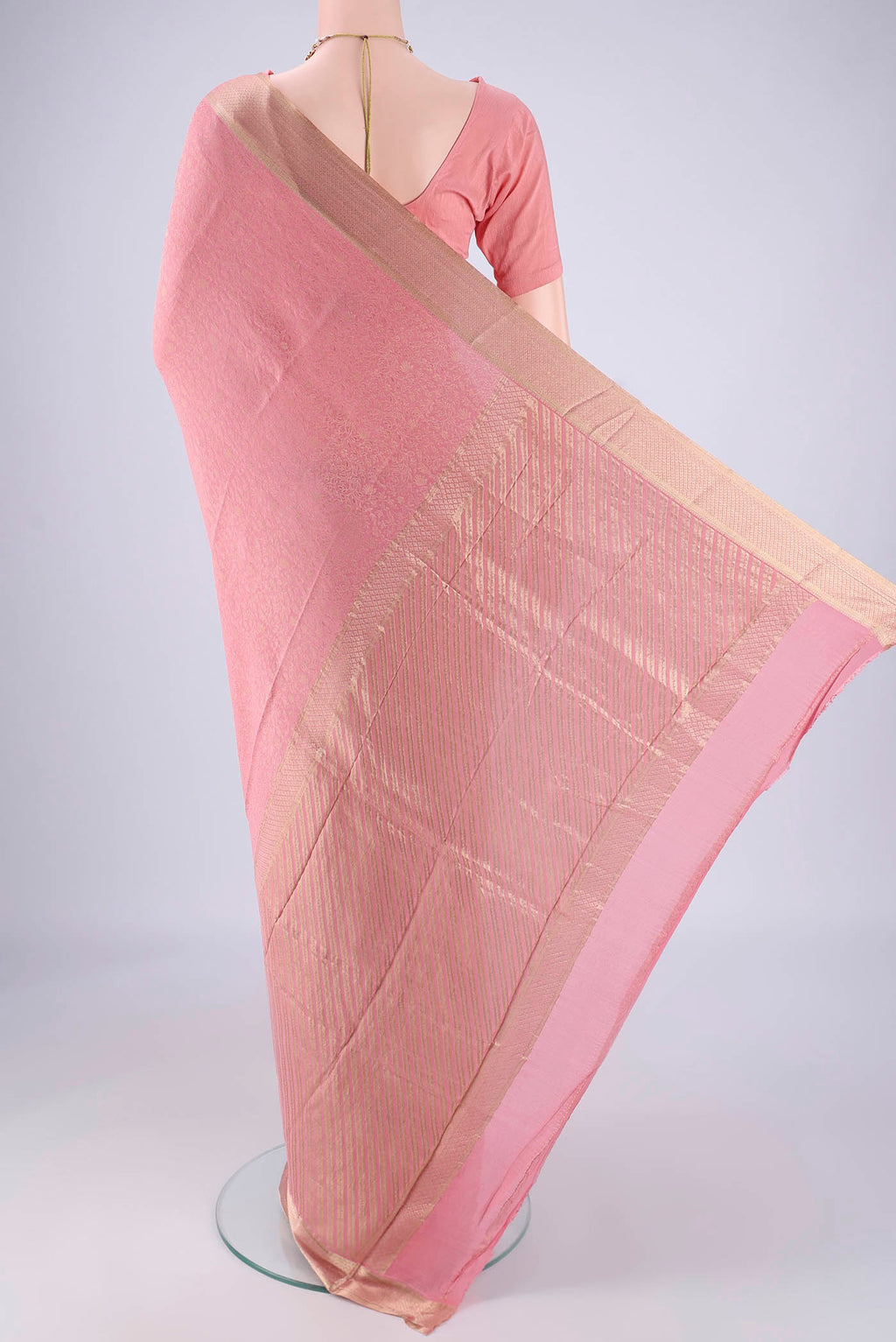 Flat view of Rose pink Mysore Crepe Saree with Zari Brocade on the body and Zari Border. 