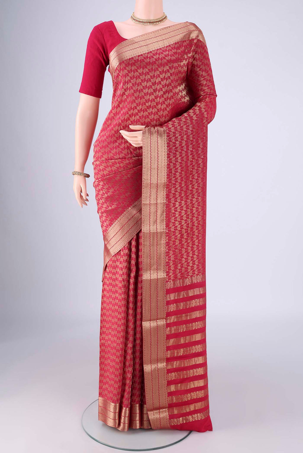 Dark Pink Mysore Crepe Saree with Zari Brocade on the body and Zari Border.  displayed on a mannequin