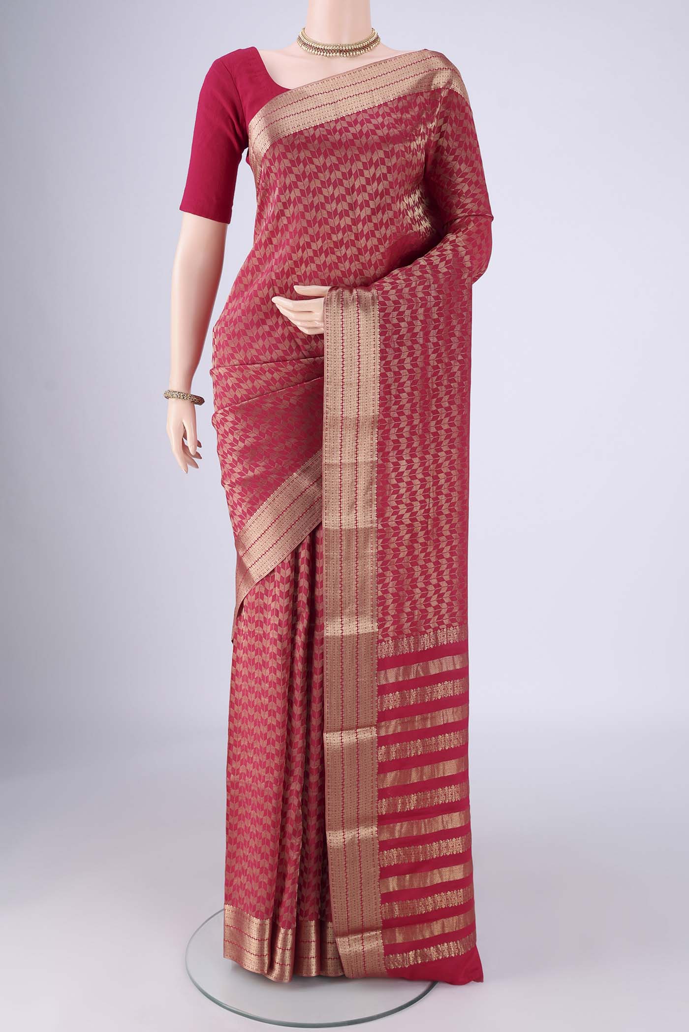 Dark Pink Mysore Crepe Saree with Zari Brocade on the body and Zari Border.  displayed on a mannequin
