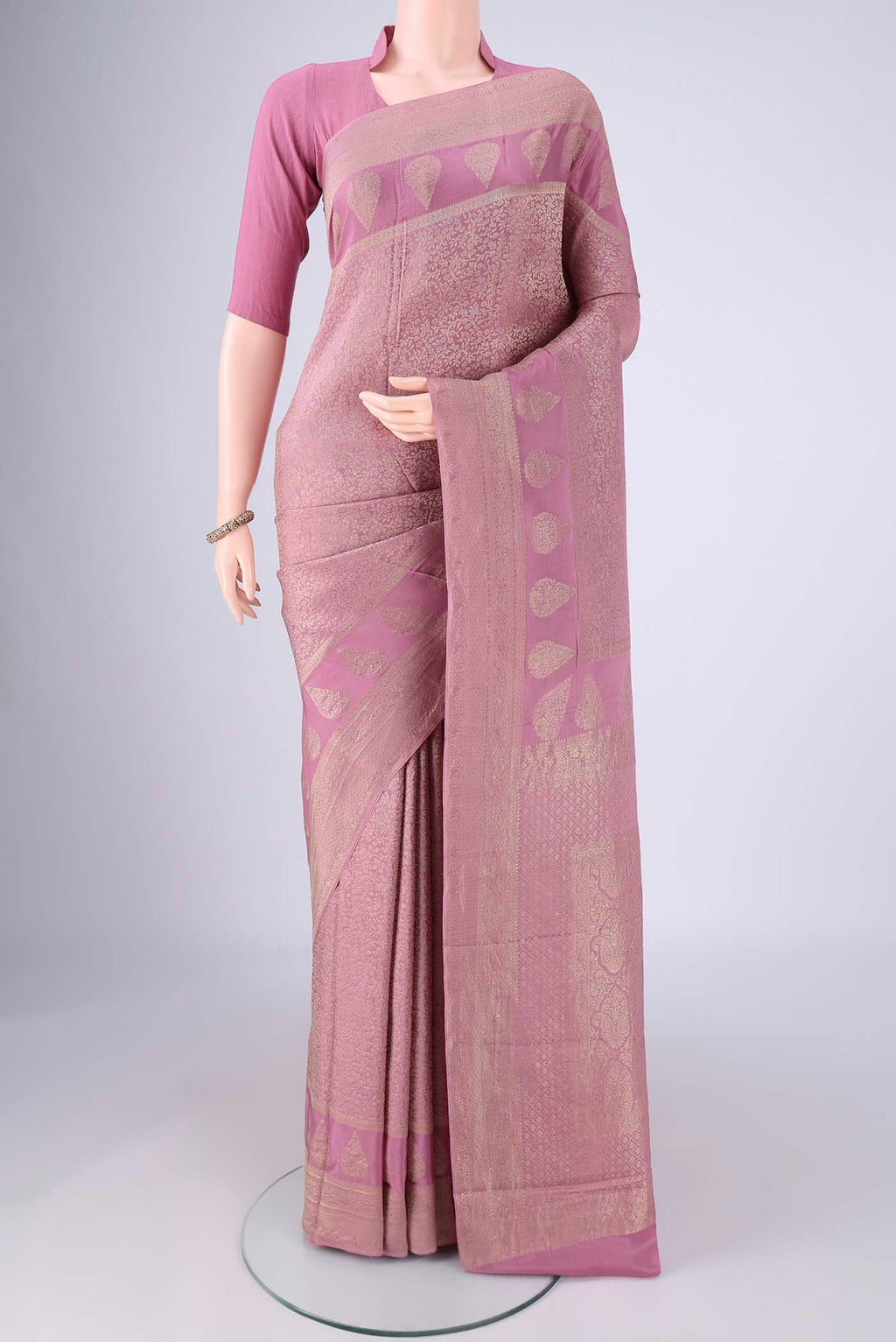 Lavender Mysore Crepe Saree with Zari Brocade on the body and Zari Border.  displayed on a mannequin