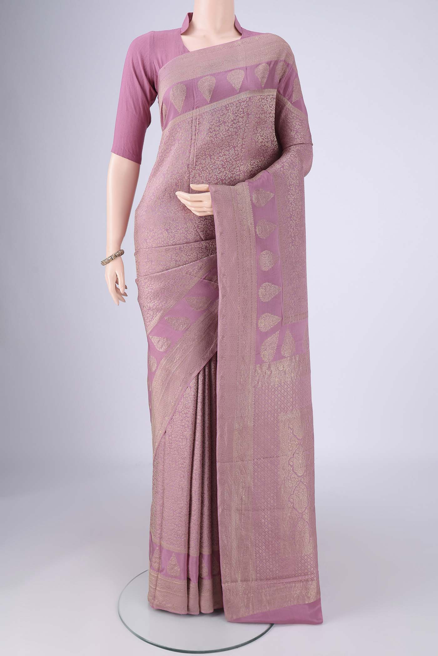 Lavender Mysore Crepe Saree with Zari Brocade on the body and Zari Border.  displayed on a mannequin