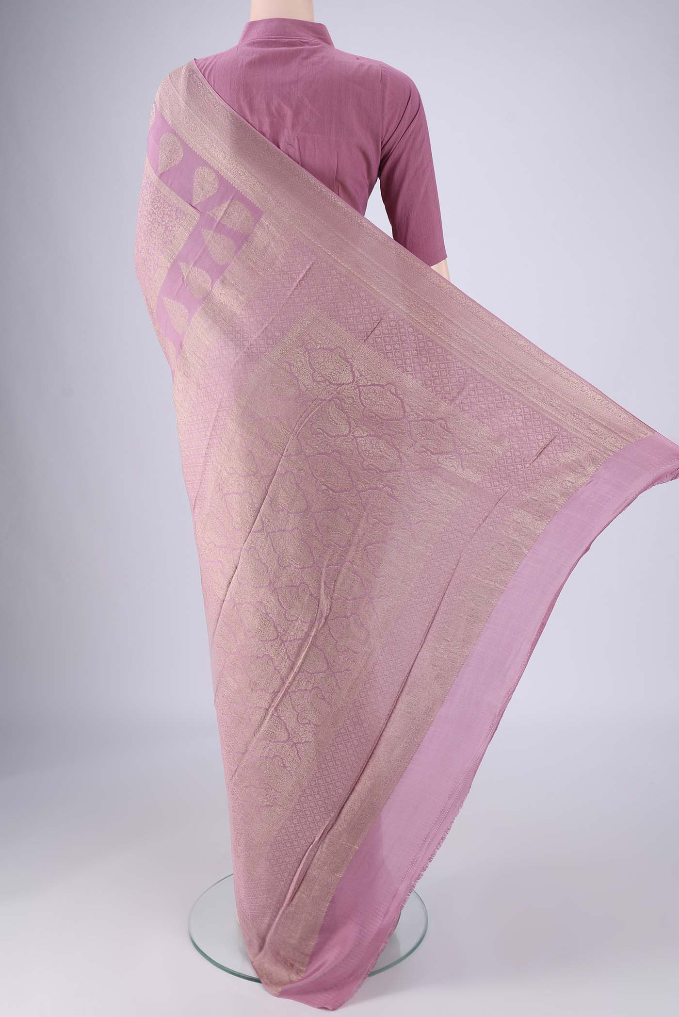 Flat view of Lavender Mysore Crepe Saree with Zari Brocade on the body and Zari Border. 