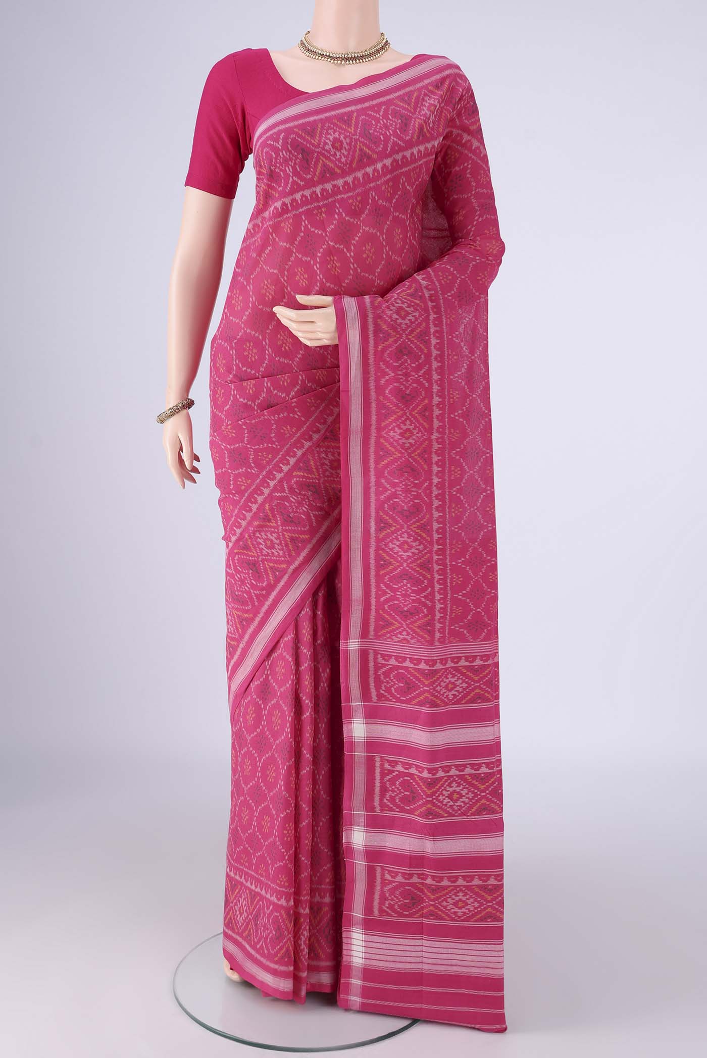 Pink Pochampally Cotton Saree with Pure Ikat on the body and Ikat Border.  displayed on a mannequin