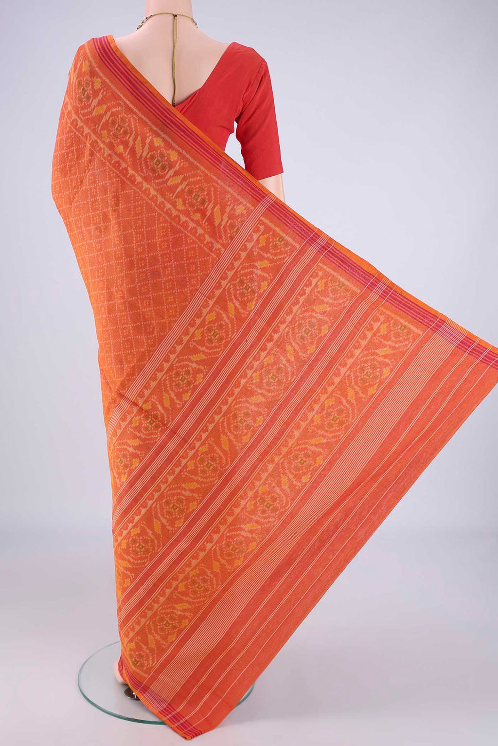 Flat view of Brick Orange Pochampally Cotton Saree with Pure Ikat on the body and Ikat Border. 