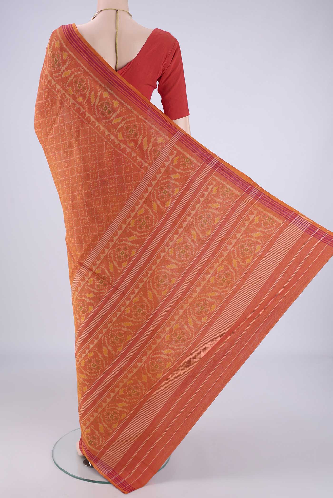 Flat view of Brick Orange Pochampally Cotton Saree with Pure Ikat on the body and Ikat Border. 