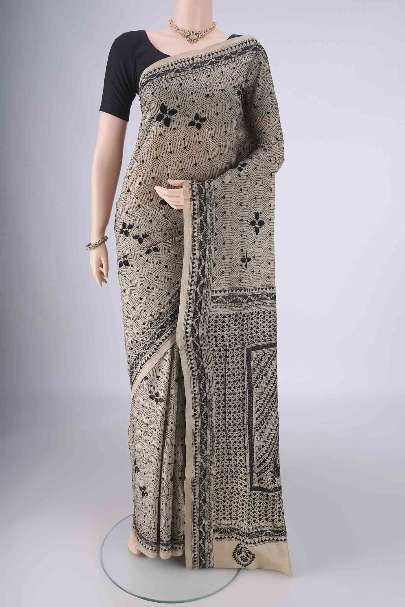 Beige Tussar Silk Saree with Kantha Work on the body and Thread Border.  displayed on a mannequin