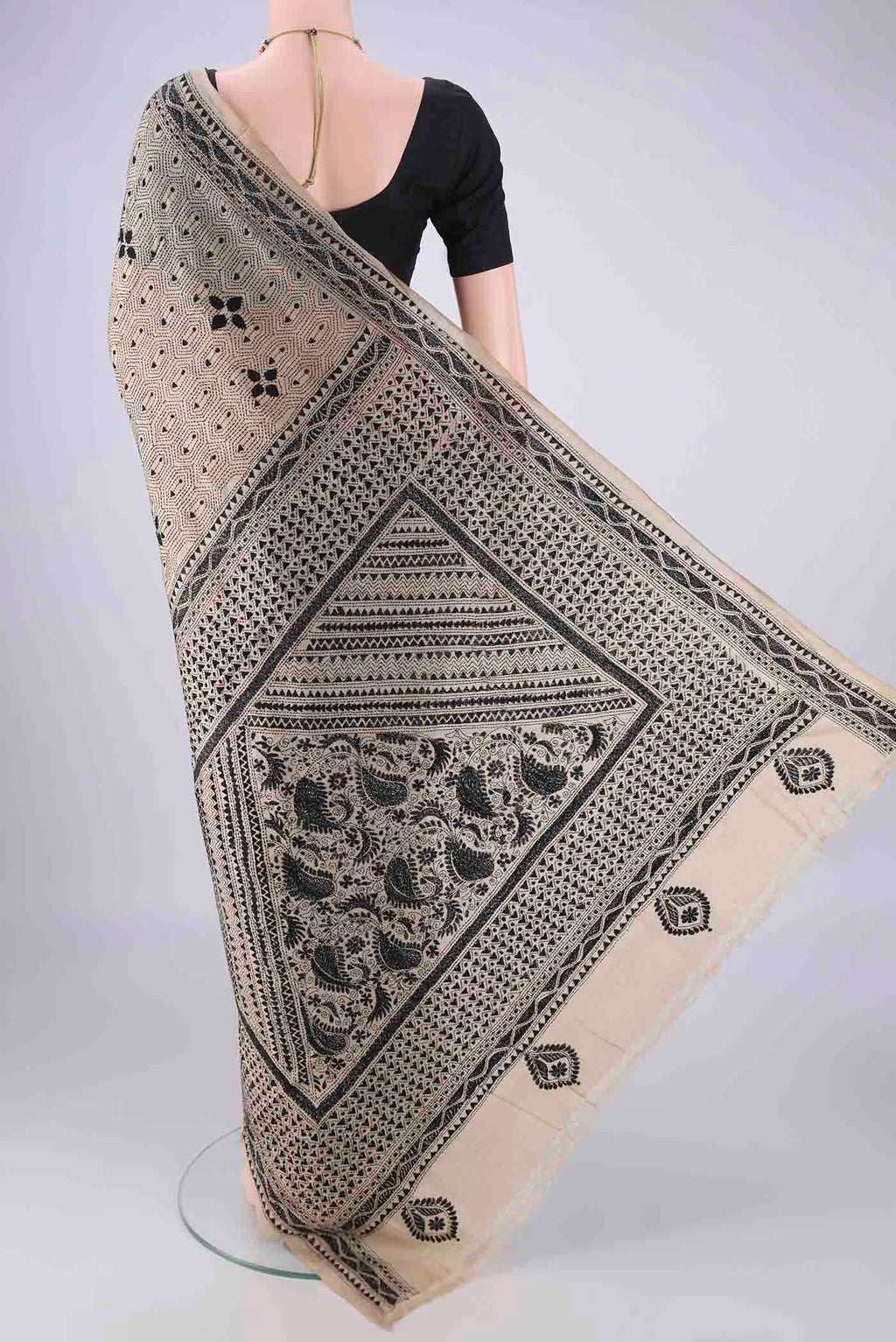 Flat view of Beige Tussar Silk Saree with Kantha Work on the body and Thread Border. 