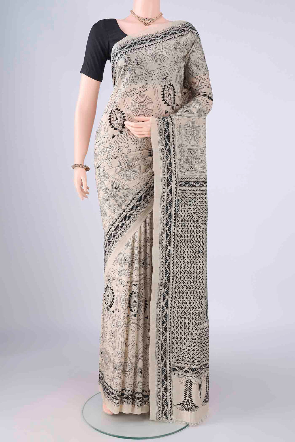 Beige Tussar Silk Saree with Kantha Work on the body and Thread Border.  displayed on a mannequin