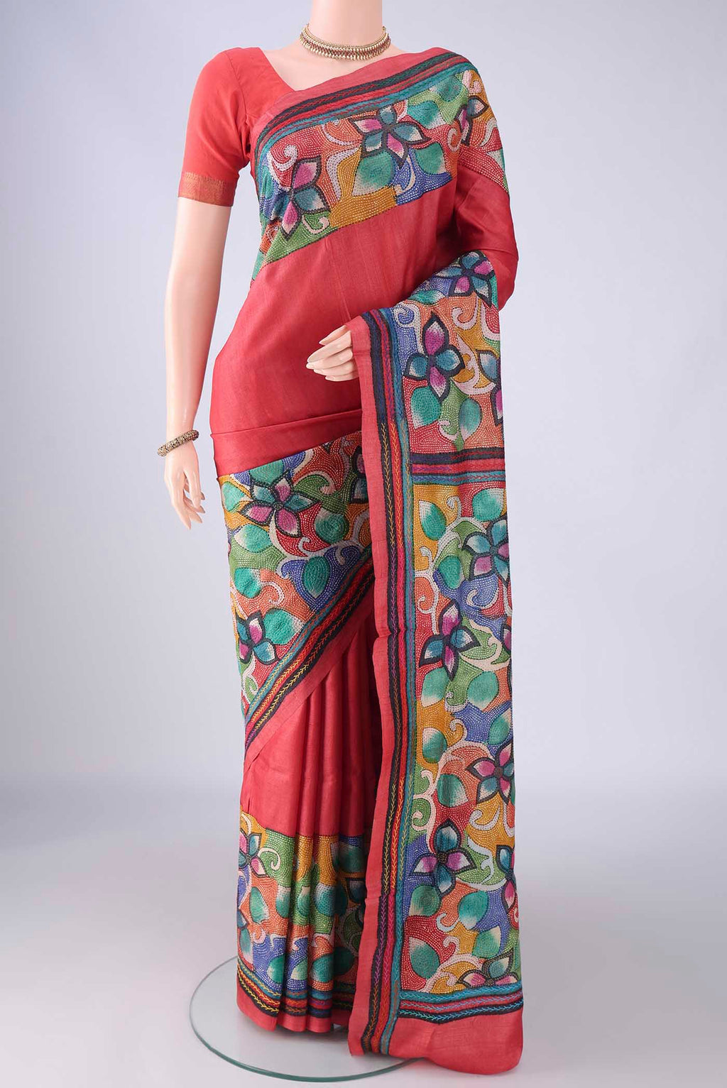Coral Tussar Silk Saree with Kantha Work on the body and Embroidery Border.  displayed on a mannequin