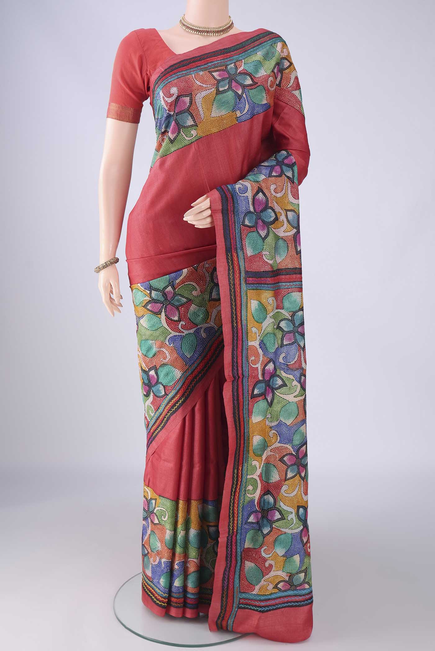 Coral Tussar Silk Saree with Kantha Work on the body and Embroidery Border.  displayed on a mannequin