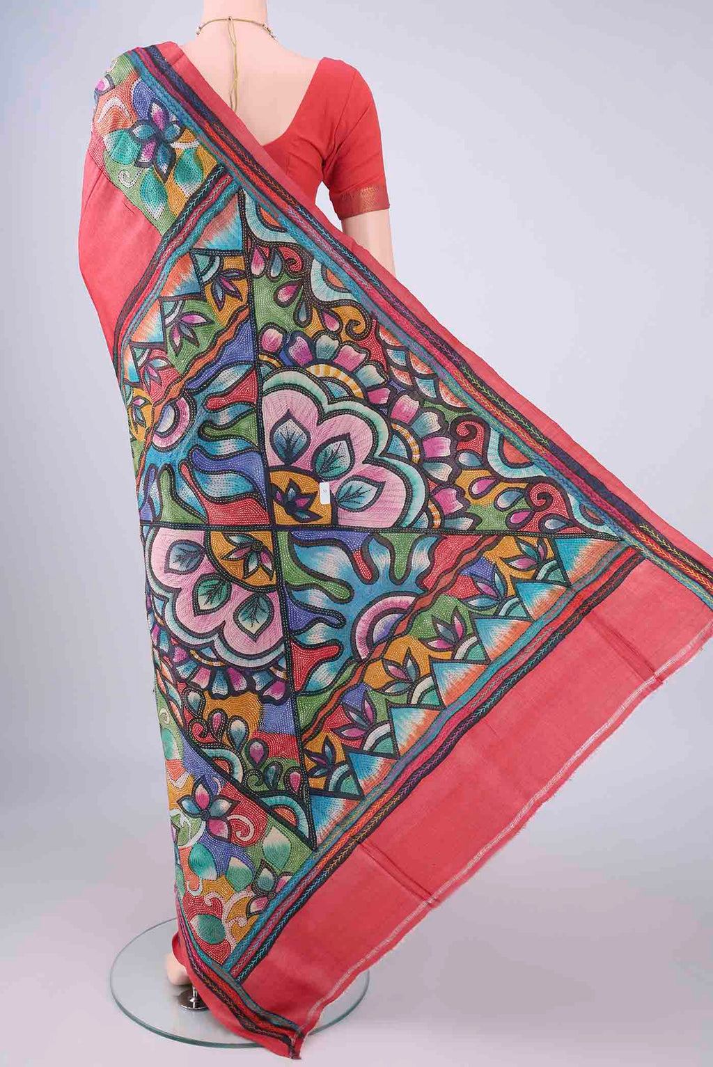 Flat view of Coral Tussar Silk Saree with Kantha Work on the body and Embroidery Border. 