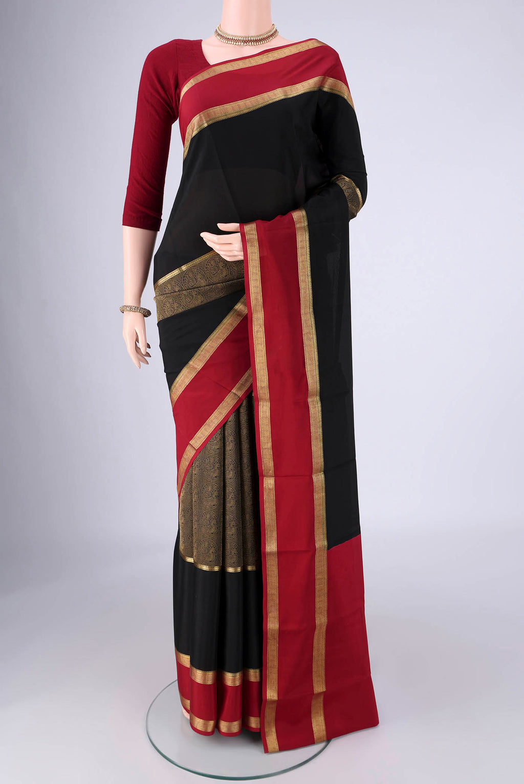 Black Mysore Crepe Saree with Zari Brocade on the body and Zari Border.  displayed on a mannequin