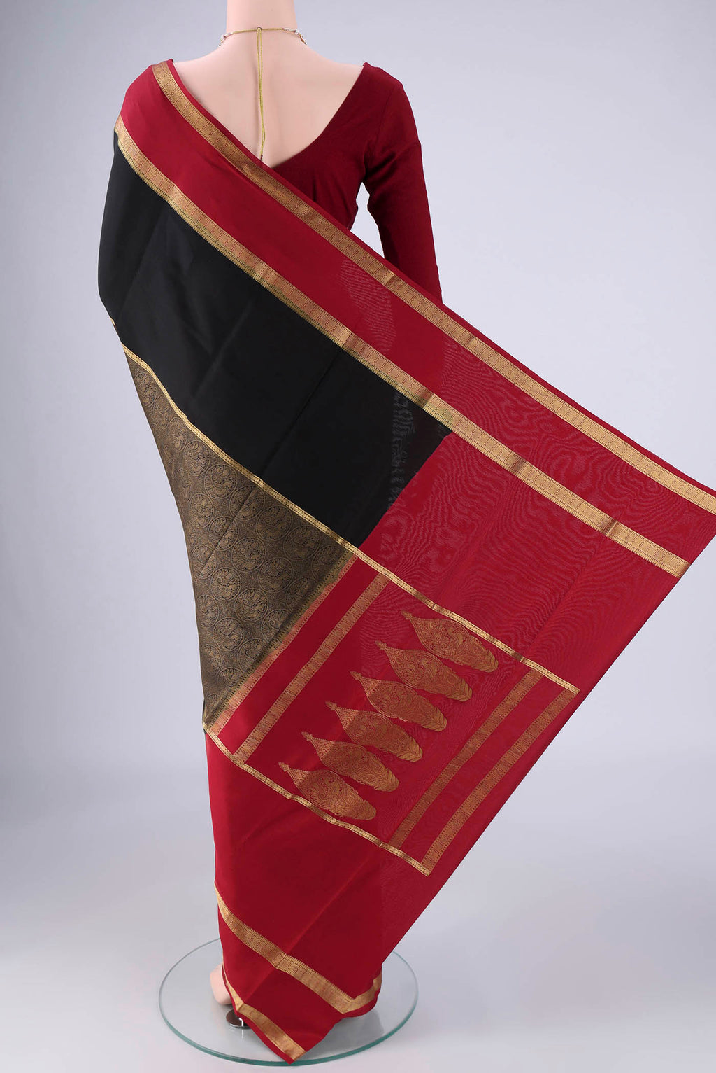 Flat view of Black Mysore Crepe Saree with Zari Brocade on the body and Zari Border. 
