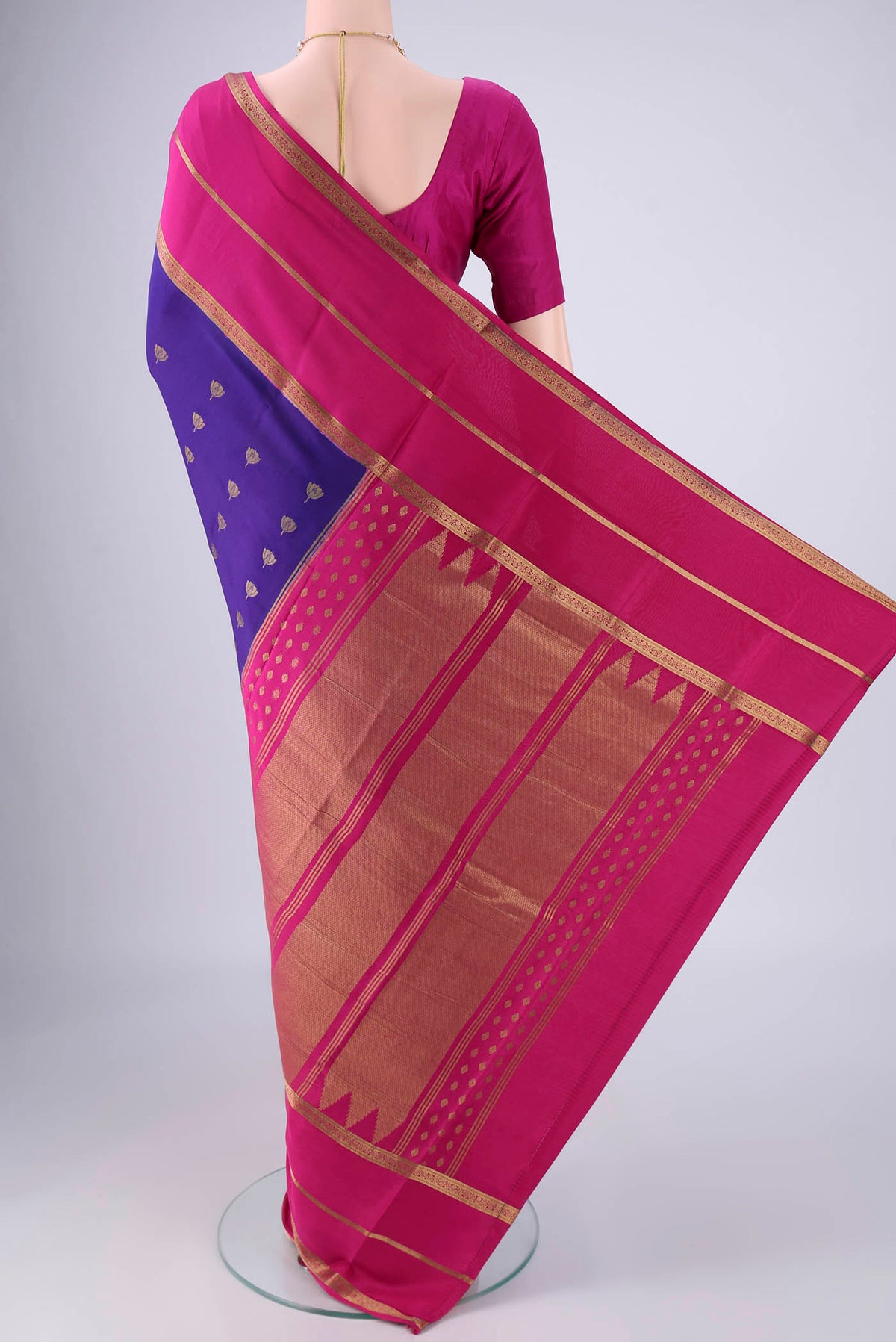 Flat view of Blue Mysore Crepe Saree with Zari Butta on the body and Zari Border. 