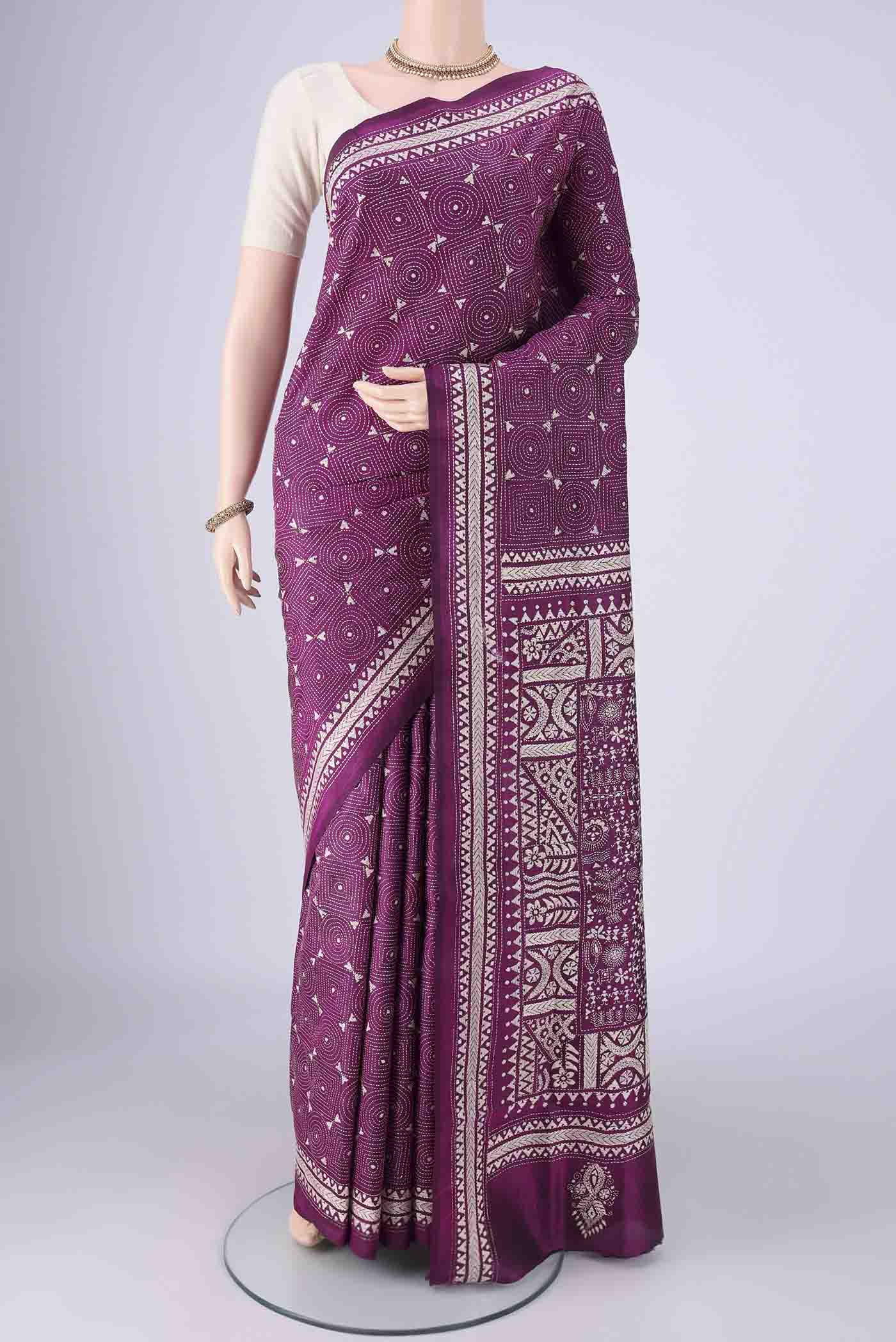 Magenta Kantha Silk Saree with Kantha Work on the body and Thread Border.  displayed on a mannequin